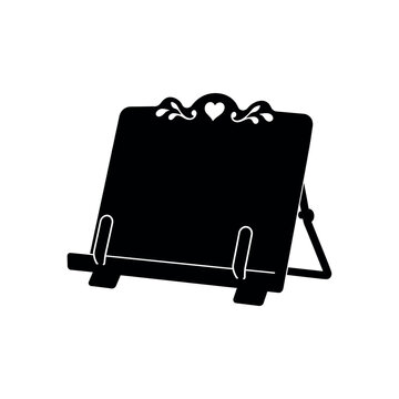 Black silhouette of a decorative wooden cookbook stand on a white background
