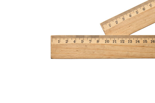 Two wooden rulers forming a right angle on white background