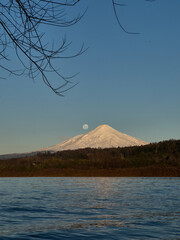 Villarrica volcano and moonlight over lake villarrica © monica