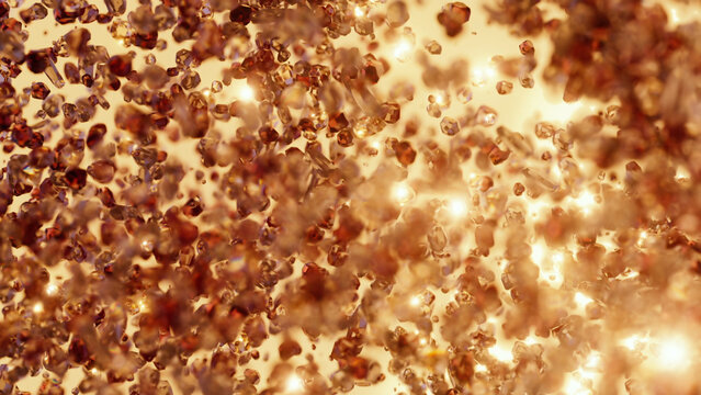 Gems and particles shine brightly in a warm, red background that mimics the look of fire stones