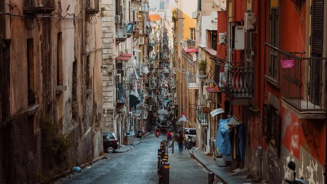 Spaccanapoli Napoli street with people and houses typical traffic