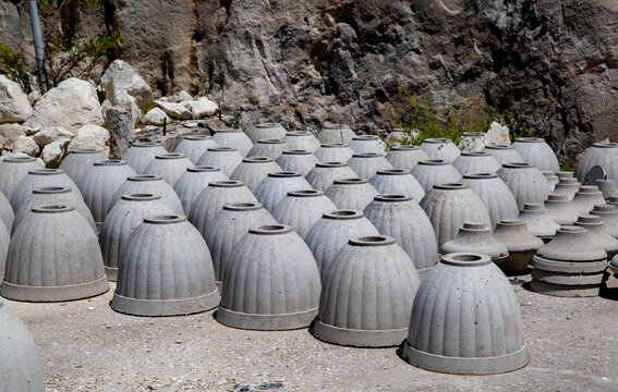 Clay vases and pots standing on the ground.  Archeology excavations folk art World tourism.
