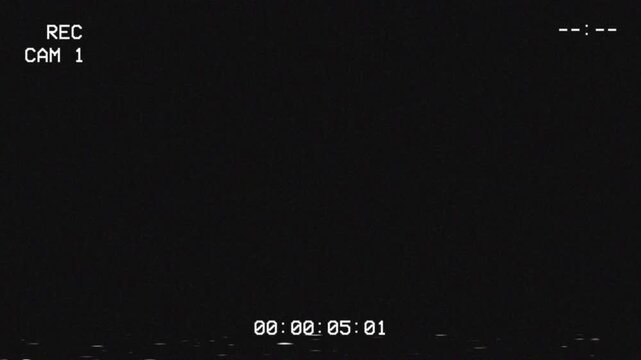 Digital surveillance camera interface on dark screen with glitch