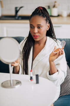 Photo of african american woman getting ready at home