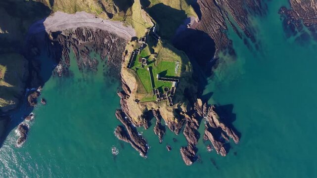 Beautiful cinematic Aerial footage of Dunnottar Castle and Dramatic Cliffs, Stonehaven Scotland &ndash; Historic Medieval Fortress on the North Sea	