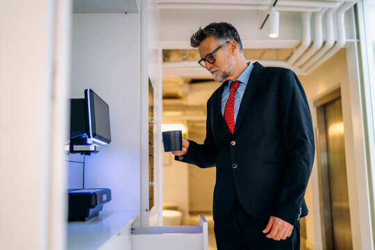 A man making coffee in the office