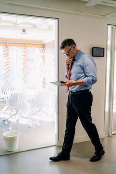 A man using a tablet in the office