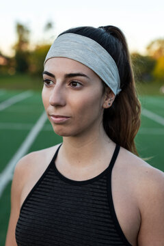 Contemplative athlete holding quiet focus on field