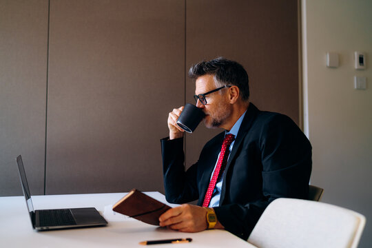 A man using a laptop in the office