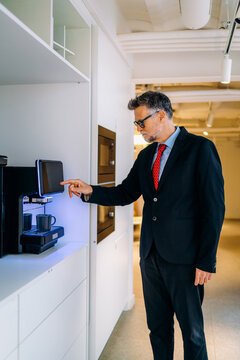 A man making coffee in the office