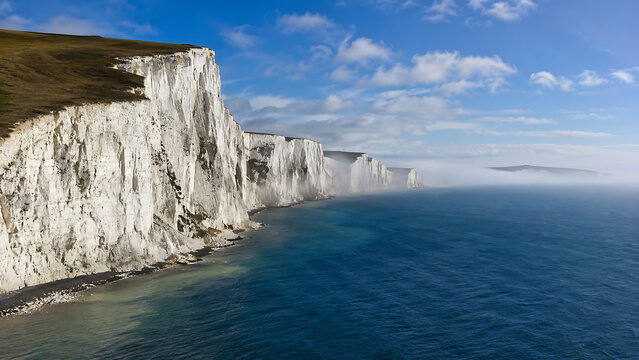 White Cliffs of Dover, England &mdash; massive white chalk cliffs overlooking deep blue ocean water