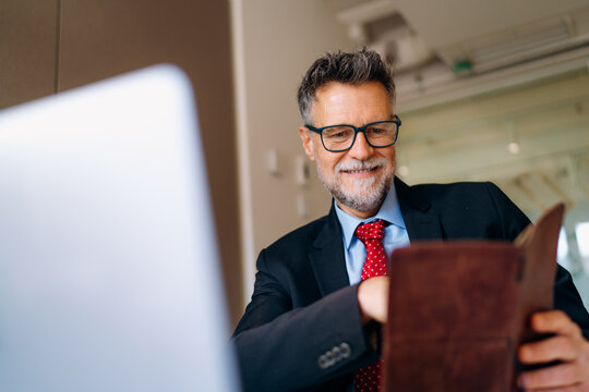 A man using a laptop in the office