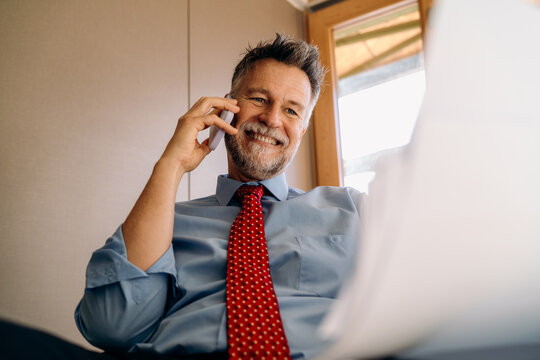 A man talking on a mobile phone in the office