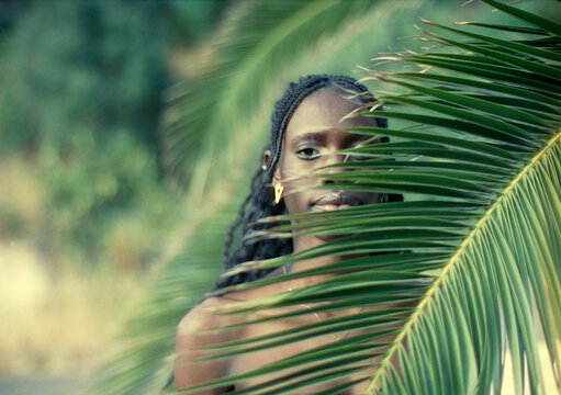Portrait Behind Palm Leaves