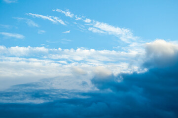 Fototapeta premium Blue evening sky with colorful clouds, dramatic sunset cloudscape