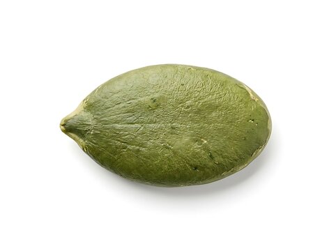 Single raw pumpkin seed isolated on a white background for healthy food and nutrition concepts