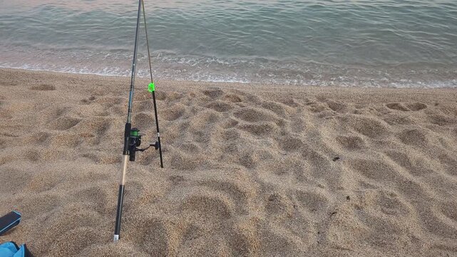 Beach Fishing at Dawn. A quiet morning unfolds as the waves kiss the shore. Experience the tranquility of nature and the excitement of angling by the ocean.