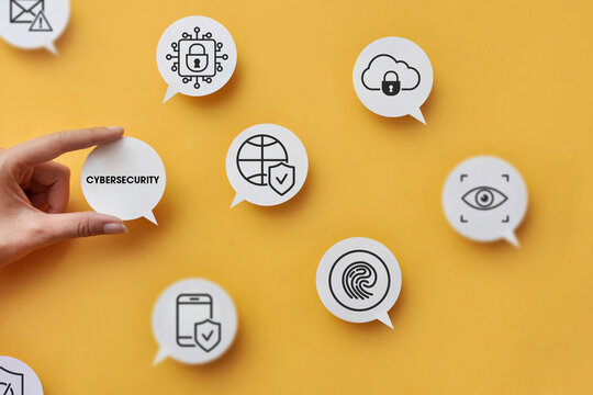 Hand Holding Cybersecurity Label Surrounded by Digital Security Icons