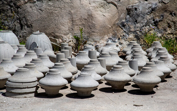 Clay vases and pots standing on the ground.  Archeology excavations folk art World tourism.