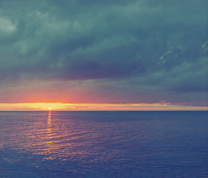 Sunset over the ocean with dark clouds, Marielyst, Denmark