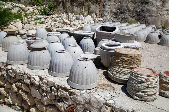 Clay vases and pots standing on the ground.  Archeology excavations folk art World tourism.