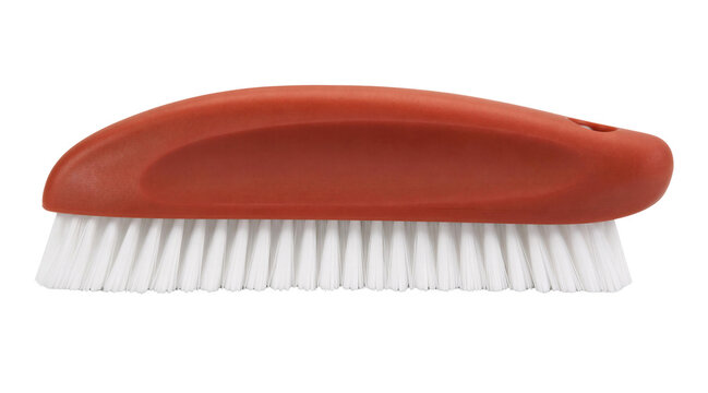 Red scrub brush with white bristles isolated on black