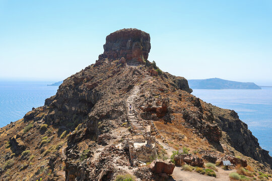 Stone steps lead up Skaros Rock in Imerovigli, Santorini, Greece &mdash; a historic volcanic fortress offering panoramic views of the Aegean Sea.