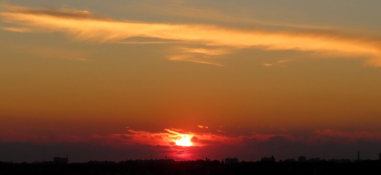 Beautiful sunset background, the sun goes down over the horison