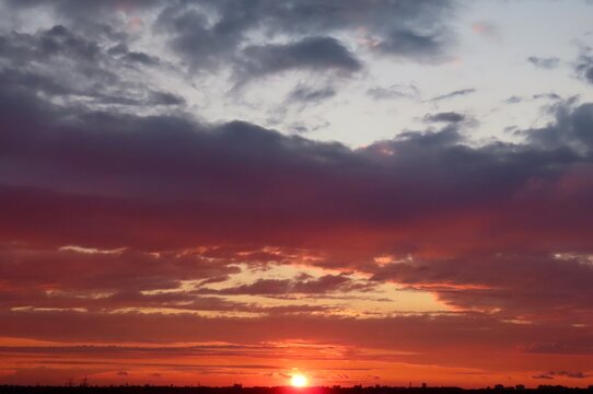 Beautiful sunset background, the sun goes down over the horison