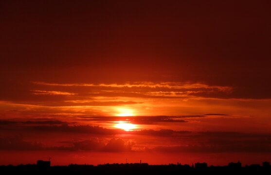 Beautiful sunset background, the sun goes down over the horison