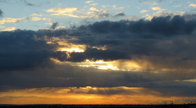 Beautiful sunset background, the sun goes down over the horison