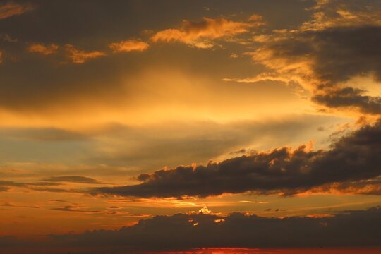 Beautiful sunset background, the sun goes down over the horison