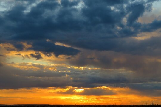 Beautiful sunset background, the sun goes down over the horison