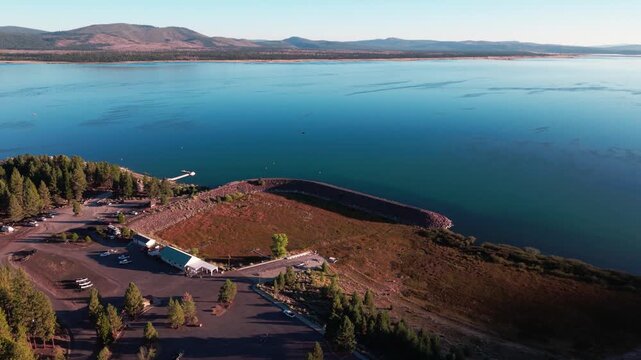 Aerial drone flyover of Gallatin Marina at Eagle Lake, Lassen County, California, showing unusable boat launch and dry exposed lakebed due to prolonged drought.