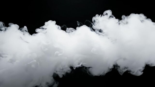 Dense white smoke cloud on black background.