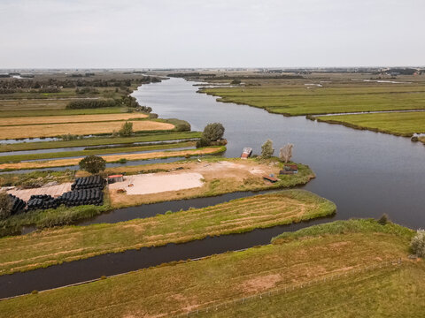 Aerial view of wetland farmland crossed by canals in the Netherlands