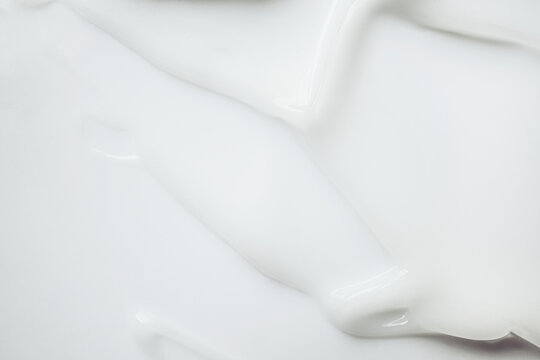 Smooth white skincare cream background