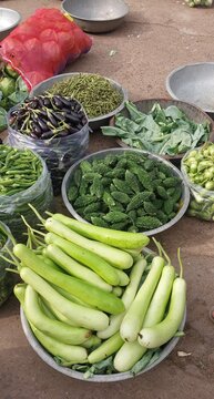 Fresh Eggplants and Green Vegetables at Farmers Market