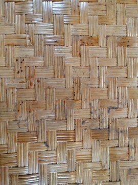Natural woven rattan texture background, traditional Asian handmade craft pattern.