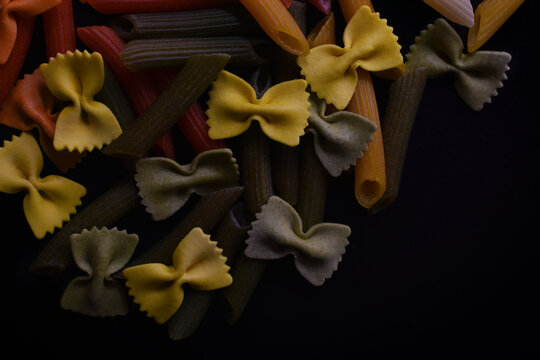 Fresh colorful Italian pasta in different shapes