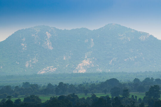 Monsoon view of Ajodhya Hills and green agricultural field , rural village , Purulia, West Bengal, India. Purulia is travel destination for it's natural beauty and lush green scenery in rainy season.