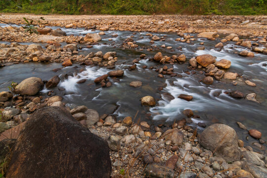 Jaldhaka River, flowing through India, Bhutan, and Bangladesh. Originating from Kupup Lake in East Sikkim. Stones at river bed of Joldhaka river, Jhalong - Dooars , north bengal - West Bengal, India.