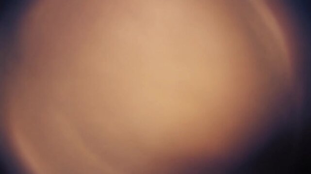 Abstract Light Leak Overlay with Soft Golden Glow and Dark Edges