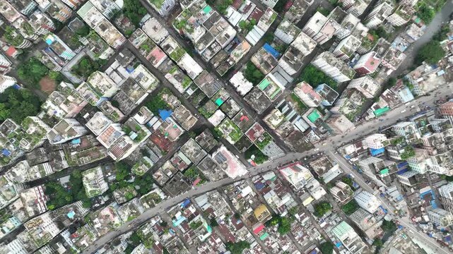 Top-down aerial view of Dhaka Mirpur residential district revealing dense urban buildings, connected street network, and city infrastructure.