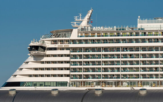 Southampton Doxks southern England UK. 26.07.2026. A large white passenger vessel with multiple decks and balconies is docked under a bright blue sky, showcasing the distinctive AIDA Perla vessel.
