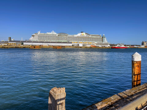 Southampton Doxks southern England UK. 26.07.2026. A large white passenger vessel with multiple decks and balconies is docked under a bright blue sky, showcasing the distinctive AIDA Perla vessel.