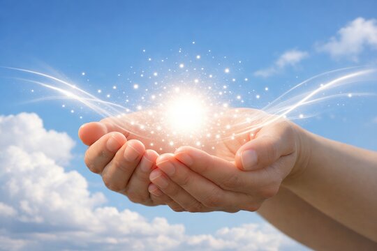 青い空の下両手に輝く未来の希望の光が無限に広がるイメージ