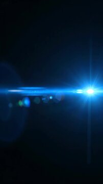 Blue lens flare dark background glowing light effect bright horizontal streaks creating futuristic dynamic glow streak visual impression