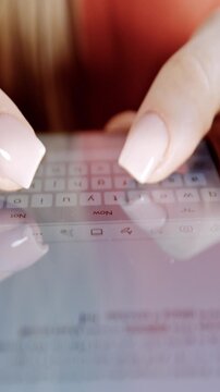 Female hands using smart phone to type or browse in vertical