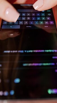 Female hands using smart phone to type or browse in vertical